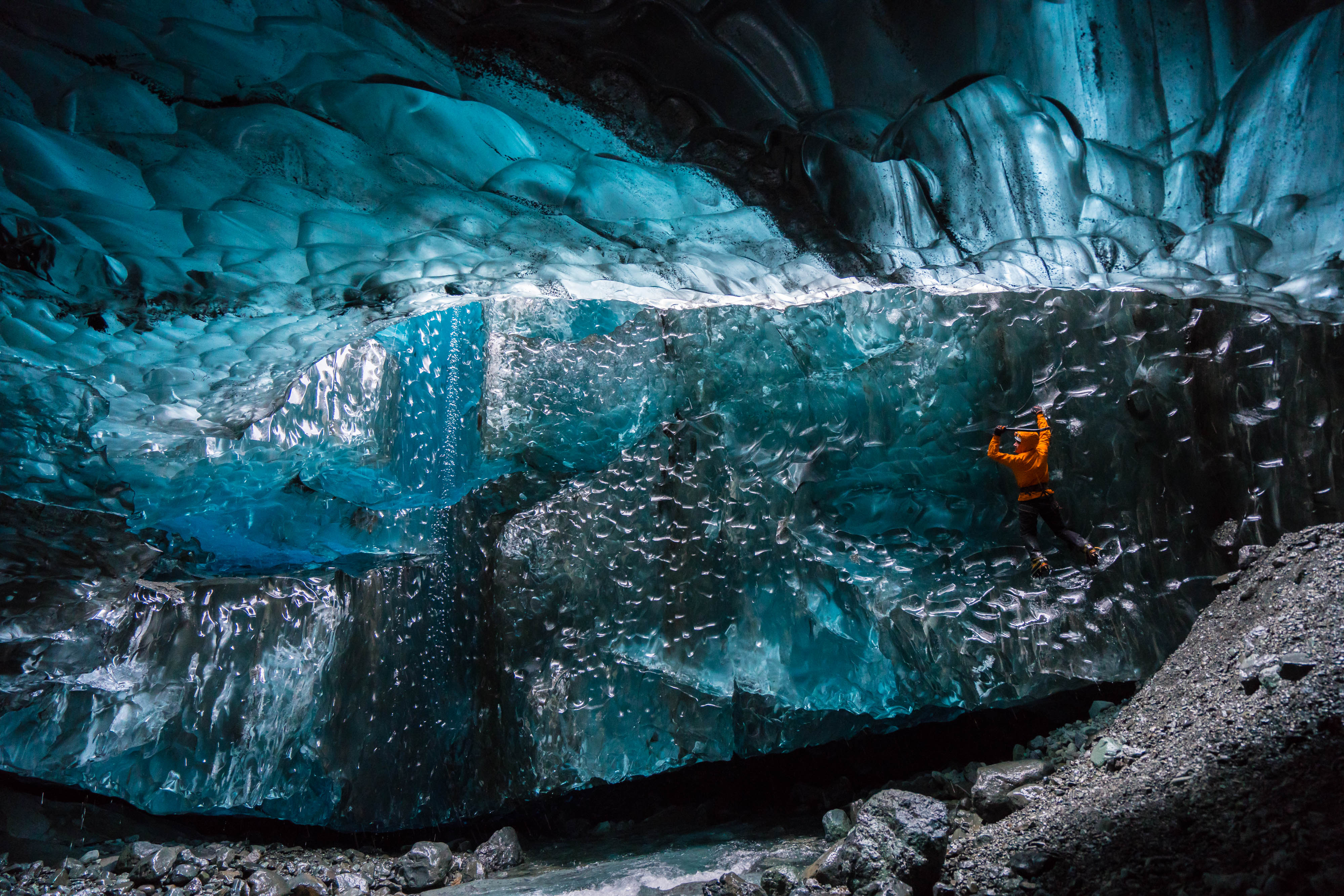 Wednesday 25th November 2015, Vatnajökull national park, Iceland: Photographer Mikael Buck with assistance from renowned local Icelandic guide Einar Runar Sigurdsson, explored the frozen world of Vatnajökull glacier in Iceland using Sonys world first back-illuminated full-frame sensor  which features in the ?7R II camera. His images were taken without use of a tripod or any image stitching techniques in photoshop. This was made possible through Sonys new sensor technology, allowing incredibly detailed low-light hand held photography. Previously images this detailed would have required carrying bulky equipment to the caves, some of which can require hiking and climbing over a glacier for up to two hours to to access. This picture: Guide Einar Runar Sigurdsson is seen ice climbing inside the 'Waterfall Cave' PR Handout - editorial usage only. Photographer's details not to be removed from metadata or byline. For further information please contact Rochelle Collison at Hope & Glory PR on 020 7014 5306 or rochelle.collison@hopeandglorypr.com Copyright: © Mikael Buck / Sony 07828 201 042 / mikaelbuck@gmail.com